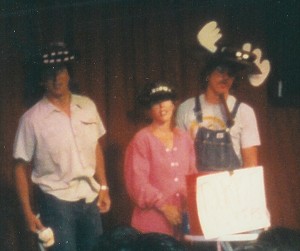 Photo of Bison, Bear, and Moose converse in the 1988 comedy sketch In A Clearing featuring (left to right) Stephan Alexander Parker, Holly Danner, and Ed Bachtel