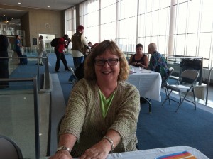 Photo of Artomatic 2012 exhibitor, photographer DJ CHoupin, at the reception for Artomatic Takes Flight.  George Koch is in the background at far right.