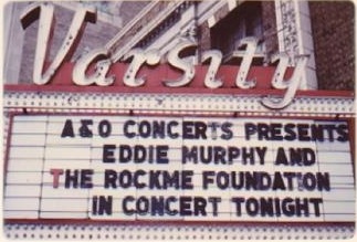 Photo of the Varsity Theater marquee reading "A&O Concerts Presents Eddie Murphy and The Rockme Foundation in Concert Tonight"