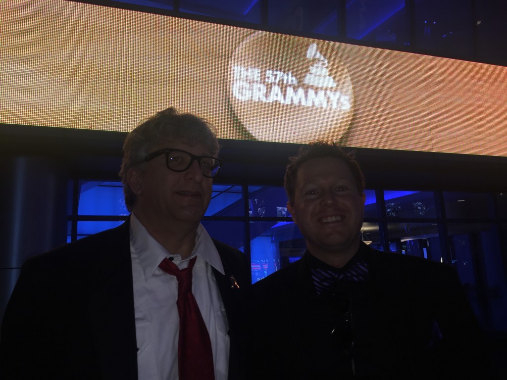 Photo of Stephan Alexander Pareker and Jeffrey Dikken below billboard with Grammy Awards logo