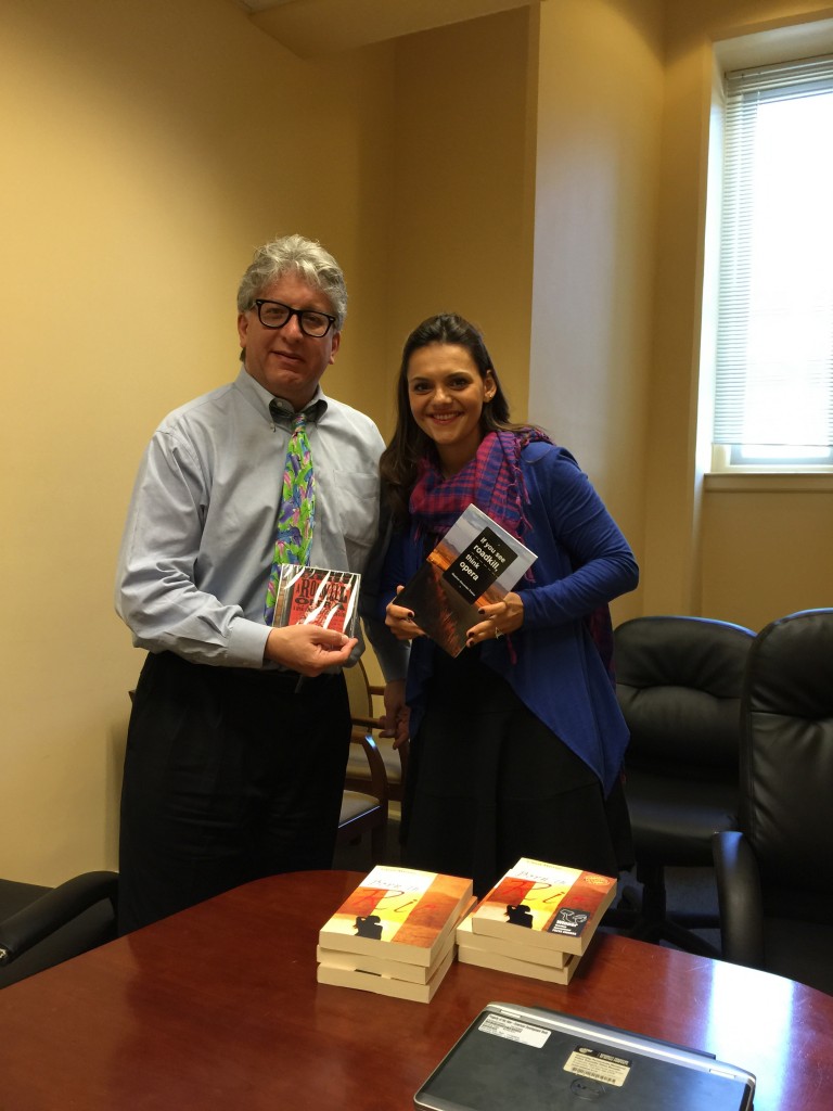 Photo of Parker and Martins with CD and books