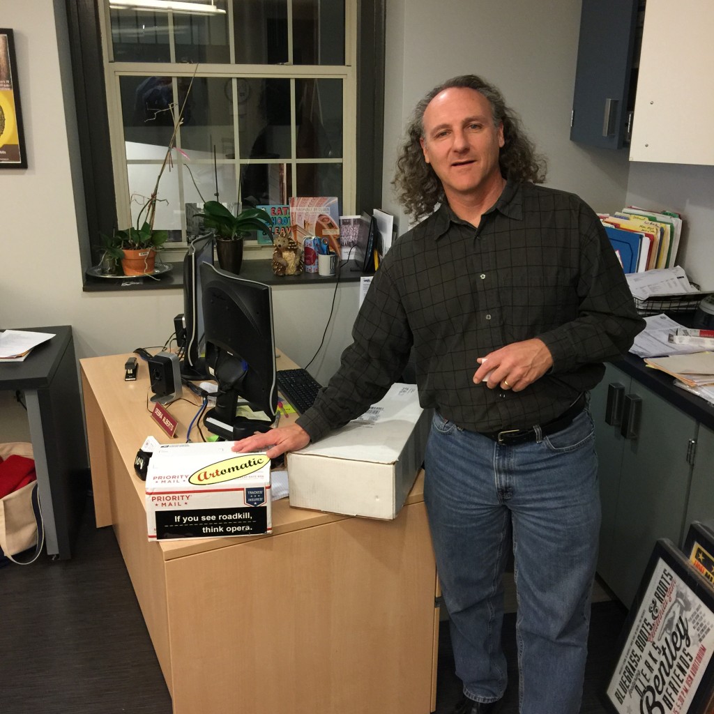 Photo of Jeff Goold receiving boxes