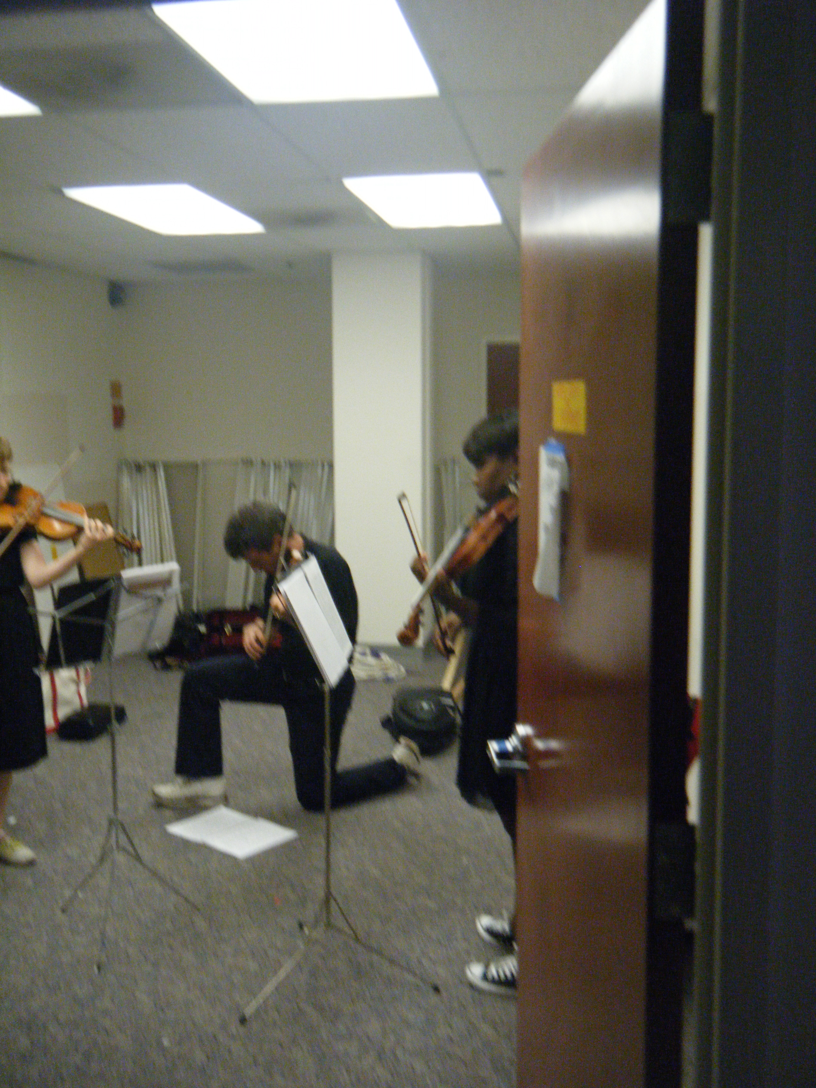 Photo of musicians warming up