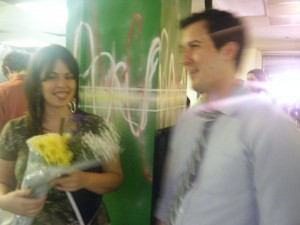 Photo of McClellan and Dellaporta with bouquet