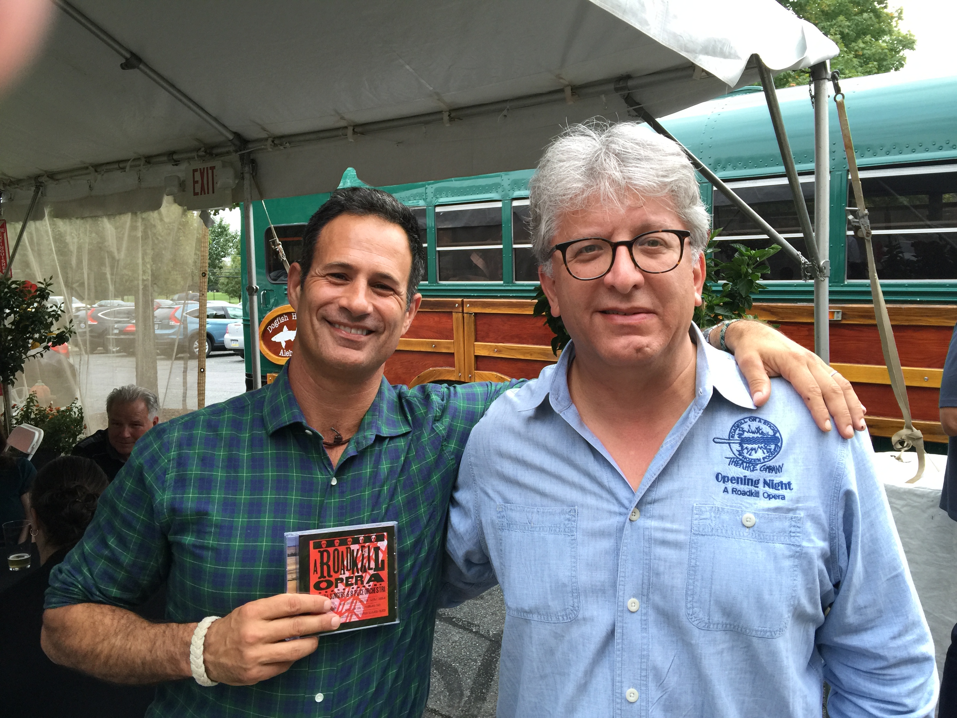 Photo of Sam Calagione and Stephan Alexander Parker with a CD of the studio recording of A Roadkill Opera