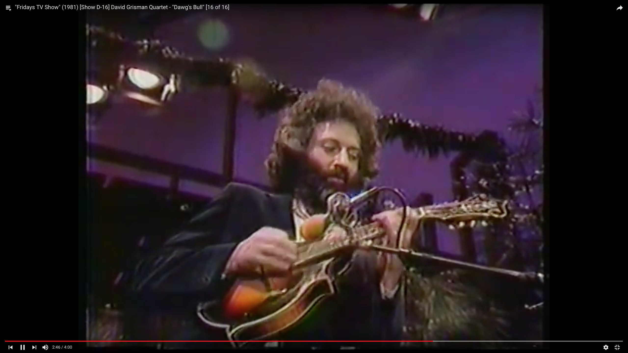 Photo of David Grisman playing the mandolin in 1981 on The Friday Club