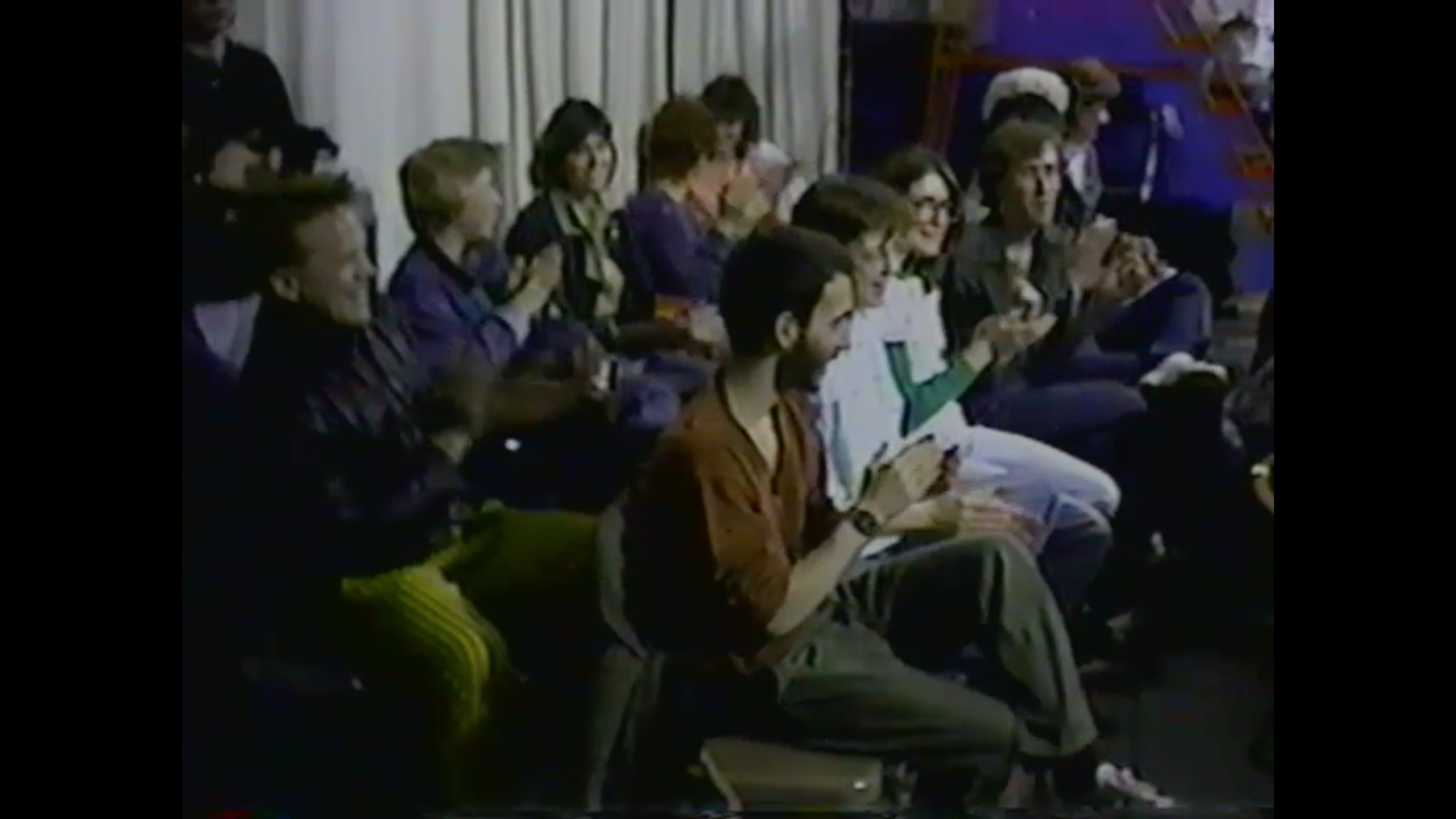 Photo of the studio audience at cable TV sketch comedy The Friday Show in 1980s Evanston, Illinois, with Cyndi Moran and Eric Scholl visible. 