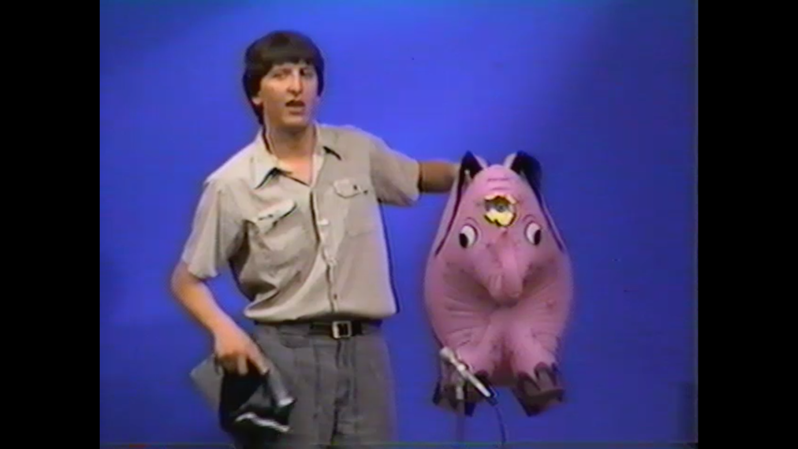 Photo of Stephan Alexander Parker introducing his comedy and magic partner, Herby the Amazing Disappearing Elephant on The Friday Club in Evanston, Illinois in the 1980s.