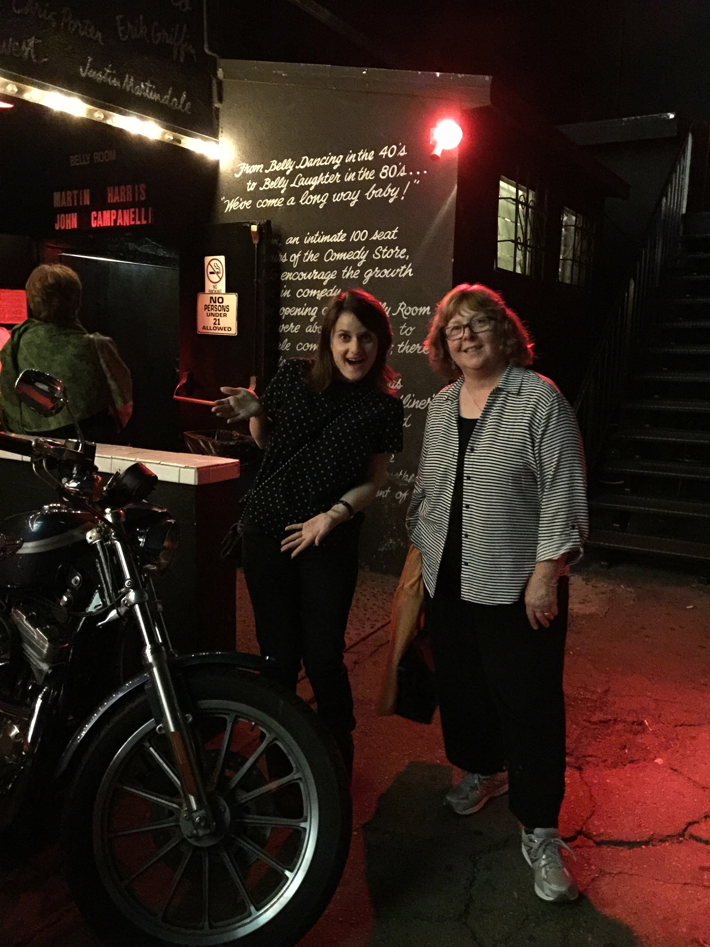 Photo of DJ Choupin and Emilia Barrosse outside, with a motorcycle.