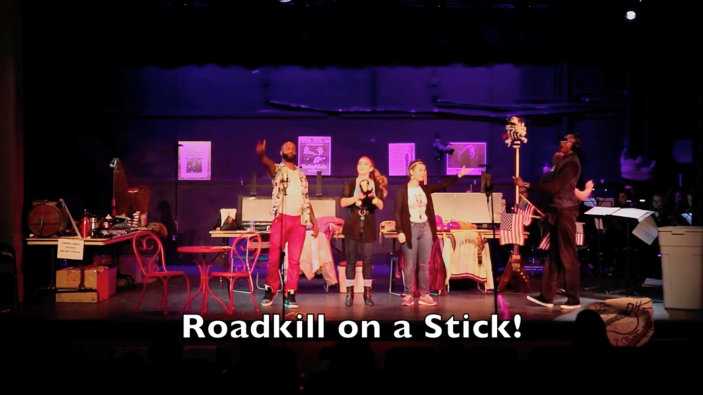 Photo of the cast (left to right): Larry Boggs, baritone, as Eddie; Laura Wehrmeyer, soprano, as Holly; Kelly Curtin, soprano, as Debbie; Christopher Dews as Marv; and conductor/music director/stage director Jeffrey Dokken onstage in the finale of the Symphony Orchestra of Northern Virginia's (SONOVA's) two free, fully staged performances of A Roadkill Opera at the James Lee Community Theater in Falls Church, Virginia on October 21, 2016. Subtitle: "Roadkill on a Stick!"